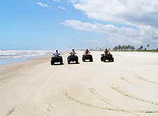 Riding ATVs on the beach