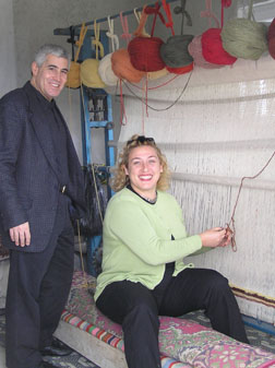 Tommy Goskin and Edward F Nesta weaving a carpet