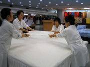 Beijing, China - Beijing Yuanlong Silk Corporation, Ltd. - stretching the silk 