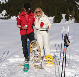 Ernesto and Debra showing off showshoes in Arosa, Switzerland