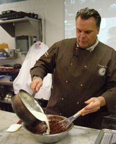 Chef Payard whisking cream and chocolate - New York Culinary Experience - Photo by Luxury Experience