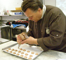 Chef Piping Macarons - New York Culinary Experience - Photo by Luxury Experience