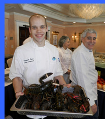 Chef John with live lobsters - photo by Luxury Experience