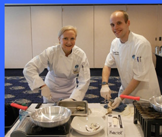 Debra Argen and Chef John shucking oysters  - photo by Luxury Experience