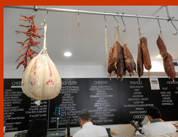 Hanging Cheese and Salami - Bricco Salumeria and Pasta Shop - photo by Luxury Experience
