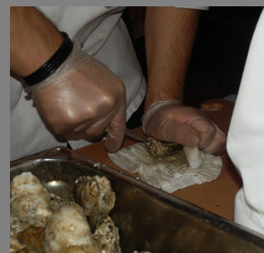 Shucking Oysters - Docks Oyster Bar and Seafood Grill - NY, NY, - photo by Luxury Experience