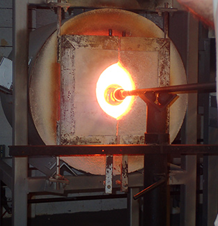 Molten glass to glory hole to start shaping process at The Hotspot Glass Studio, Fairfield, CT - photo by Luxury Experience
