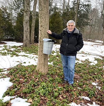 Edward F. Nesta with maple sap bucketi - Stamford Museum & Nature Center - photo by Luxury Experience