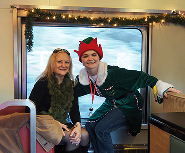 Debra Argen and Santa's Helper - Naugatuck Railroad - Thomaston, Ct- photo by Luxury Experience