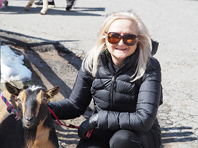 Debra C. Argen with Goat - Stamford Museum & Nature Center - photo by Luxury Experience