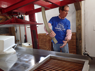 Geoff Thompson speading pomace - Thompson's Cider Mill - photo by Luxury Experience