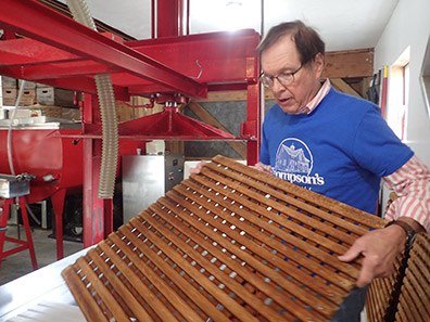 Geoff Thompson showing lattice for cider press- Thompson's Cider Mill - photo by Luxury Experience