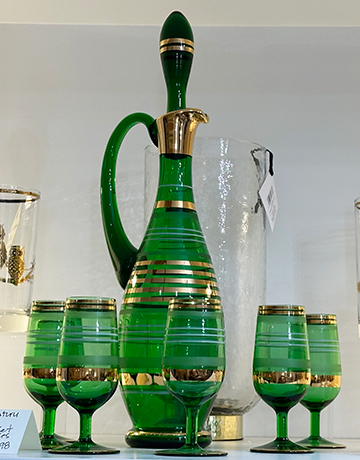 Mid Century Green Glass Decanter and Green Gold Stripe Glasses - photo by Luxury Experience