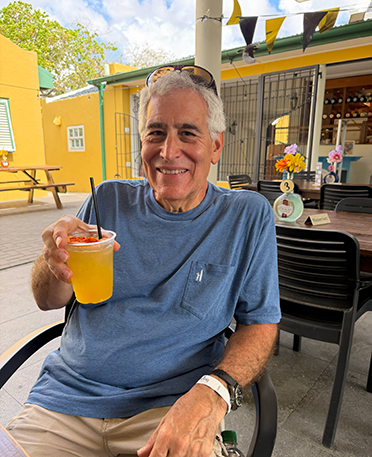 Edward F. Nesta sampling a Genuien Curaçao Liqueur Cocktail - photo by Luxury Experience